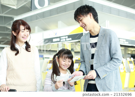 A family watching an airplane ticket 21332696