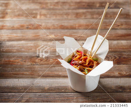 Noodles with pork and vegetables in take-out box Noodles with pork and vegetables in take-out box 21333445