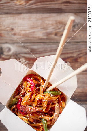 Noodles with pork and vegetables in take-out box Noodles with pork and vegetables in take-out box 21333724