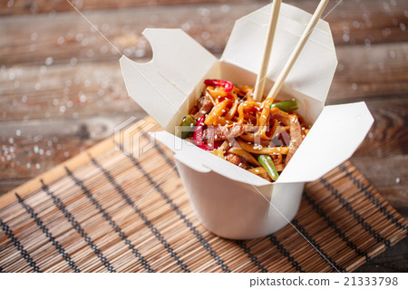 Noodles with pork and vegetables in take-out box Noodles with pork and vegetables in take-out box 21333798