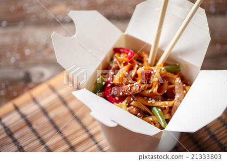 Noodles with pork and vegetables in take-out box Noodles with pork and vegetables in take-out box 21333803