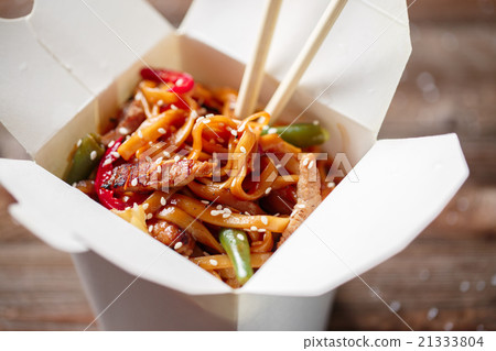Noodles with pork and vegetables in take-out box Noodles with pork and vegetables in take-out box 21333804