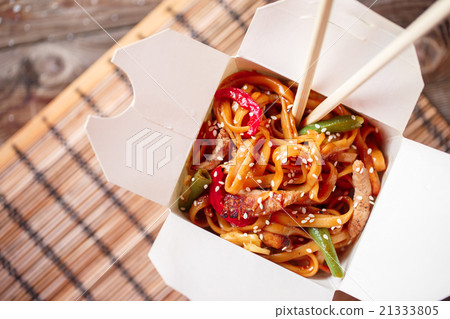 Noodles with pork and vegetables in take-out box Noodles with pork and vegetables in take-out box 21333805