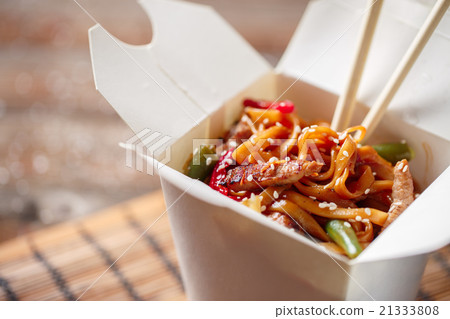 Noodles with pork and vegetables in take-out box Noodles with pork and vegetables in take-out box 21333808