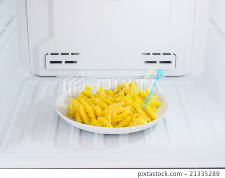 pineapple dish put on the freezer fridge 21335289