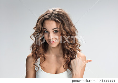 The happy woman on gray background The happy woman on gray background 21335354