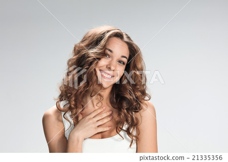 The happy woman on gray background The happy woman on gray background 21335356