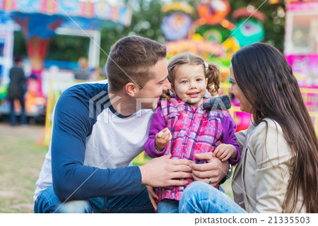Father, mother and daughter having fun in 21335503