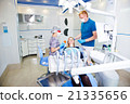 dentist treats teeth 21335656
