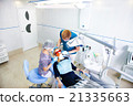 dentist treats teeth 21335663