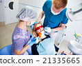 dentist treats teeth 21335665