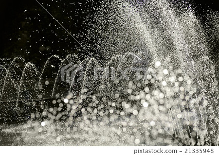 Fountain water jets in park partially blurred 21335948