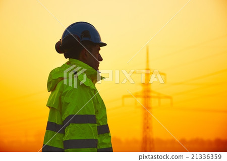 Worker at the sunset Worker at the sunset 21336359