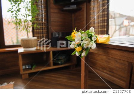 bouquet of spring flowers, tulips on a brown table bouquet of spring flowers, tulips on a brown table 21337708