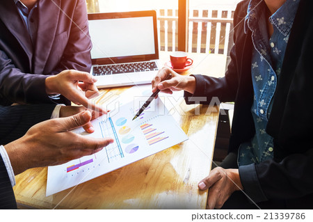 Business team working on a new business plan 21339786