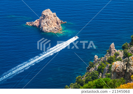 Fast motor boat goes between the stones Fast motor boat goes between the stones 21345068