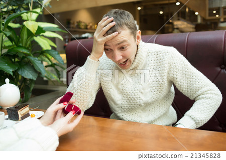 Girl gives the man a ring. feminism 21345828
