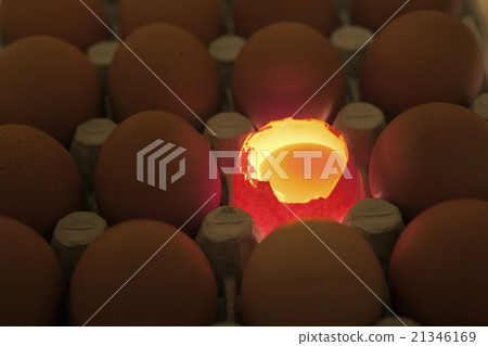 eggs, one egg it is opened, the yolk is visible an eggs, one egg it is opened, the yolk is visible an 21346169