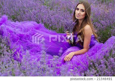 Fashion girl is sitting in lavender field  21346491