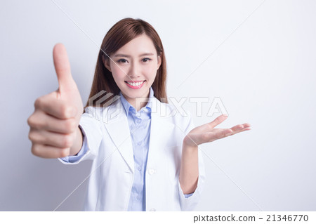 Smiling dentist woman thump up 21346770