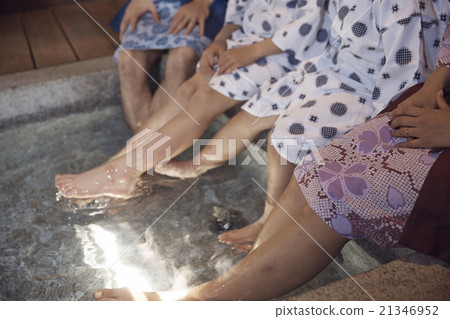 Families immersed in foot bath 21346952