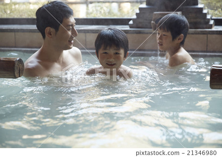Parent and child entering a hot spring 21346980