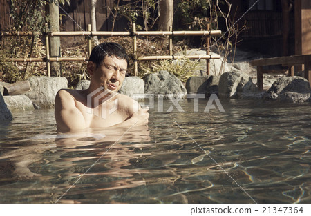 Men immersed in hot springs 21347364