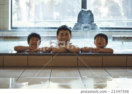 Parent and child entering a hot spring 21347398