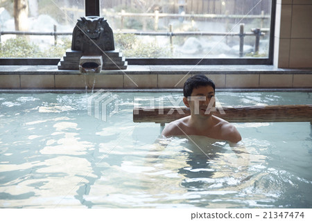 Men immersed in hot springs 21347474