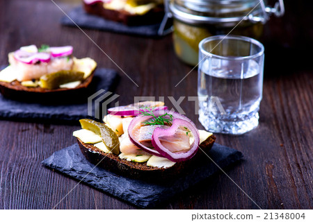 Herring sandwich with vodka glass Herring sandwich with vodka glass 21348004