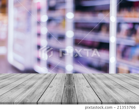 Wooden board empty table blur store in mall. 21353766