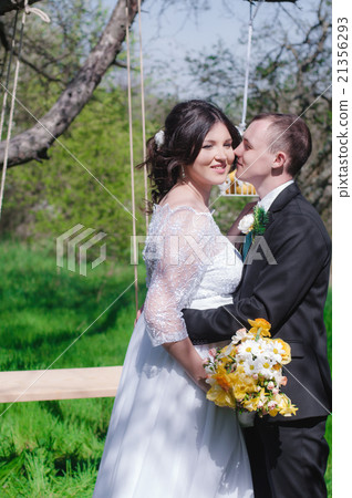 Young bride and groom in the park 21356293