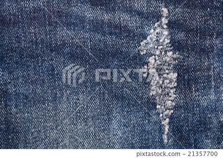torn old blue jeans use as background 21357700