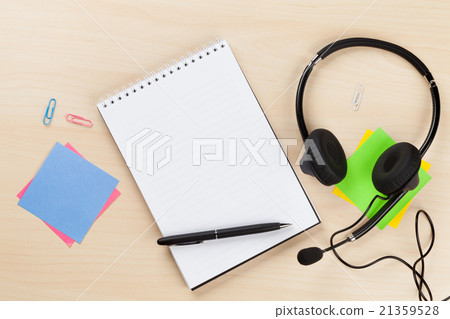 Office desk with headset and supplies. Call center Office desk with headset and supplies. Call center 21359528