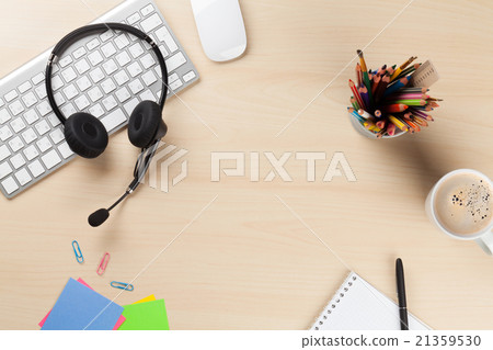 Office desk with headset, notepad and pc Office desk with headset, notepad and pc 21359530