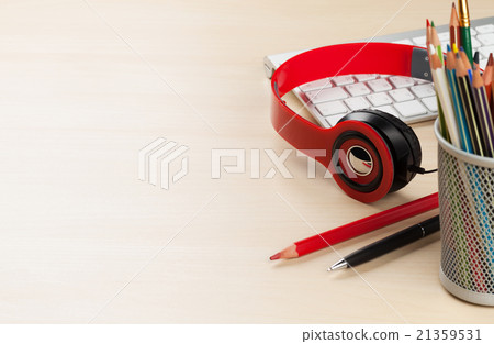 Office desk with headphones and supplies Office desk with headphones and supplies 21359531