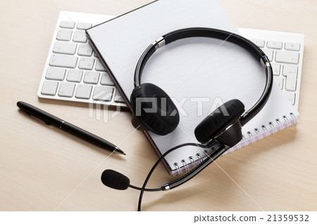 Office desk with headset. Call center support 21359532