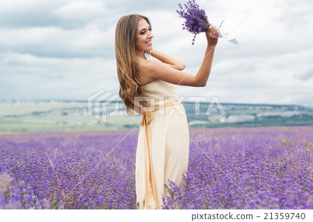 Girl is wearing wedding dress at lavender field 21359740