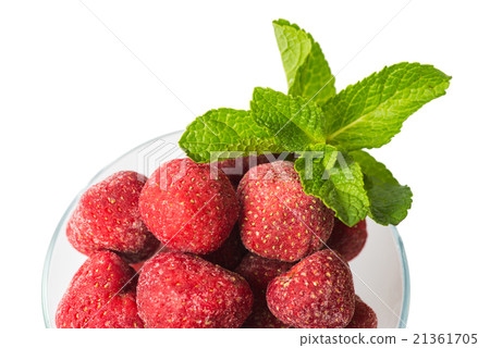 Frozen strawberries and a sprig of fresh mint 21361705