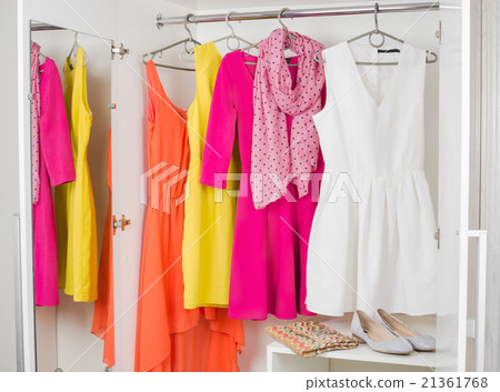 row of bright colorful dress hanging row of bright colorful dress hanging 21361768
