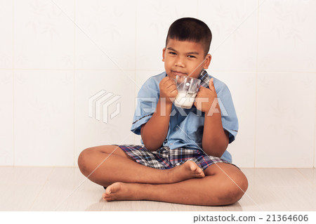 school boy drinking milk and concede school boy drinking milk and concede 21364606