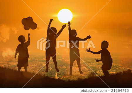 silhouette of boy happy jumping touch  the sun  21364713
