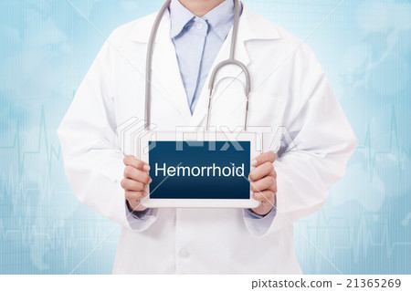 Doctor holding a tablet pc with hemorrhoid sign  21365269