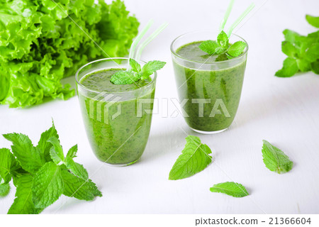 Two glasses of healthy natural green smoothies 21366604