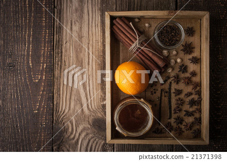 Orange , honey and spices on the wooden tray 21371398