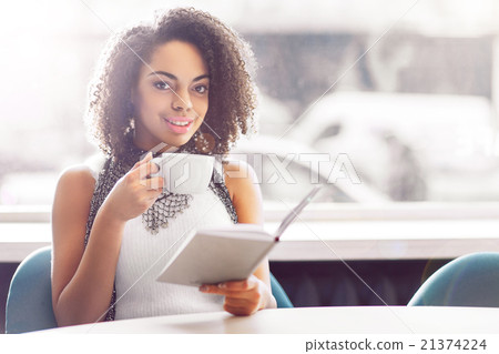 Smiling girl reading book Smiling girl reading book 21374224