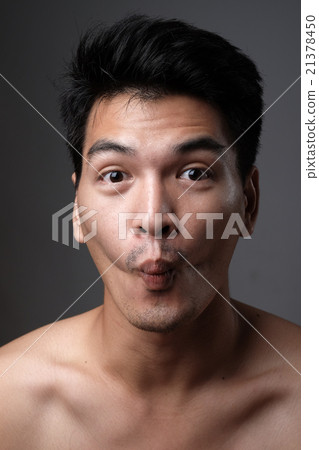 Asian man portrait with no makeup show his real skin in grey background - soft focus 21378450
