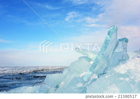 Transparent blue ice formation on the frozen lake 21380517