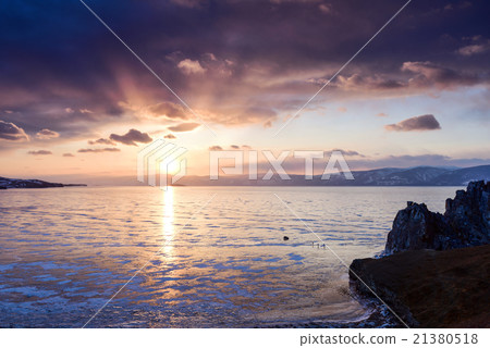 Sunset above frozen surface of the lake Baikal Sunset above frozen surface of the lake Baikal 21380518