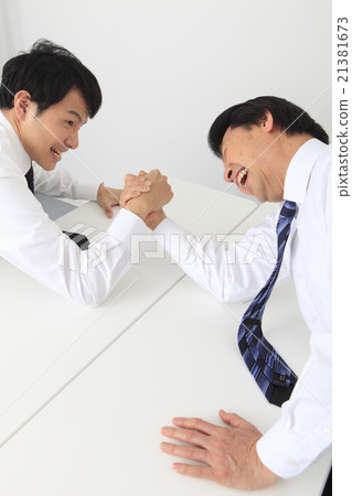 A businessman to arm sumo wrestling A businessman to arm sumo wrestling 21381673
